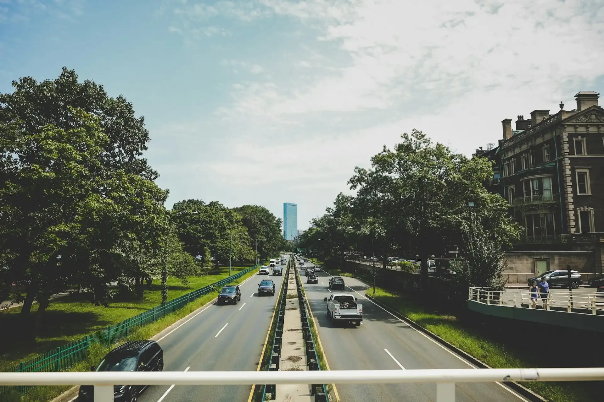 Traffic on Storrow Drive along the Charles River with the Boston skyline in Massachusetts