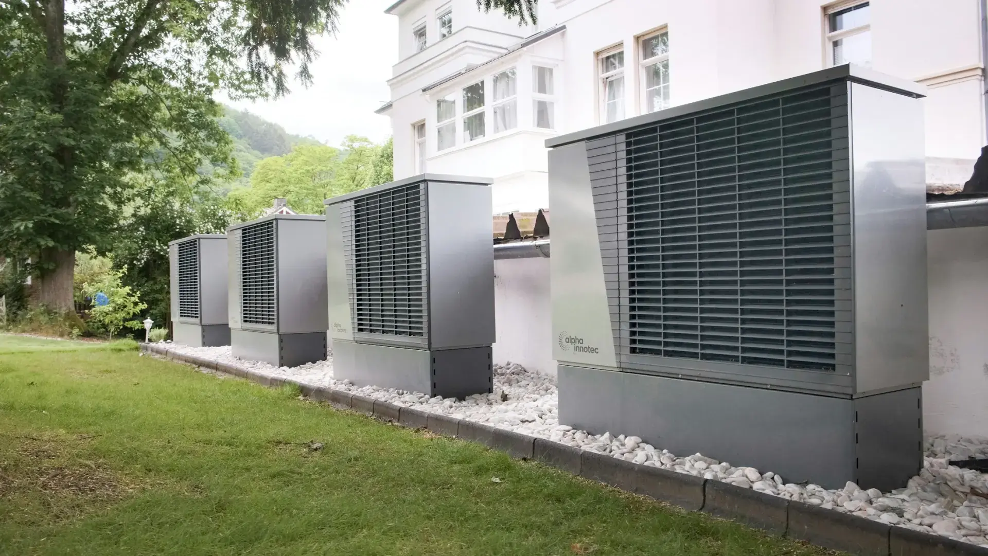 Row of outdoor heat pump units beside a building, the kind of refrigerant equipment EPA 608 technicians service