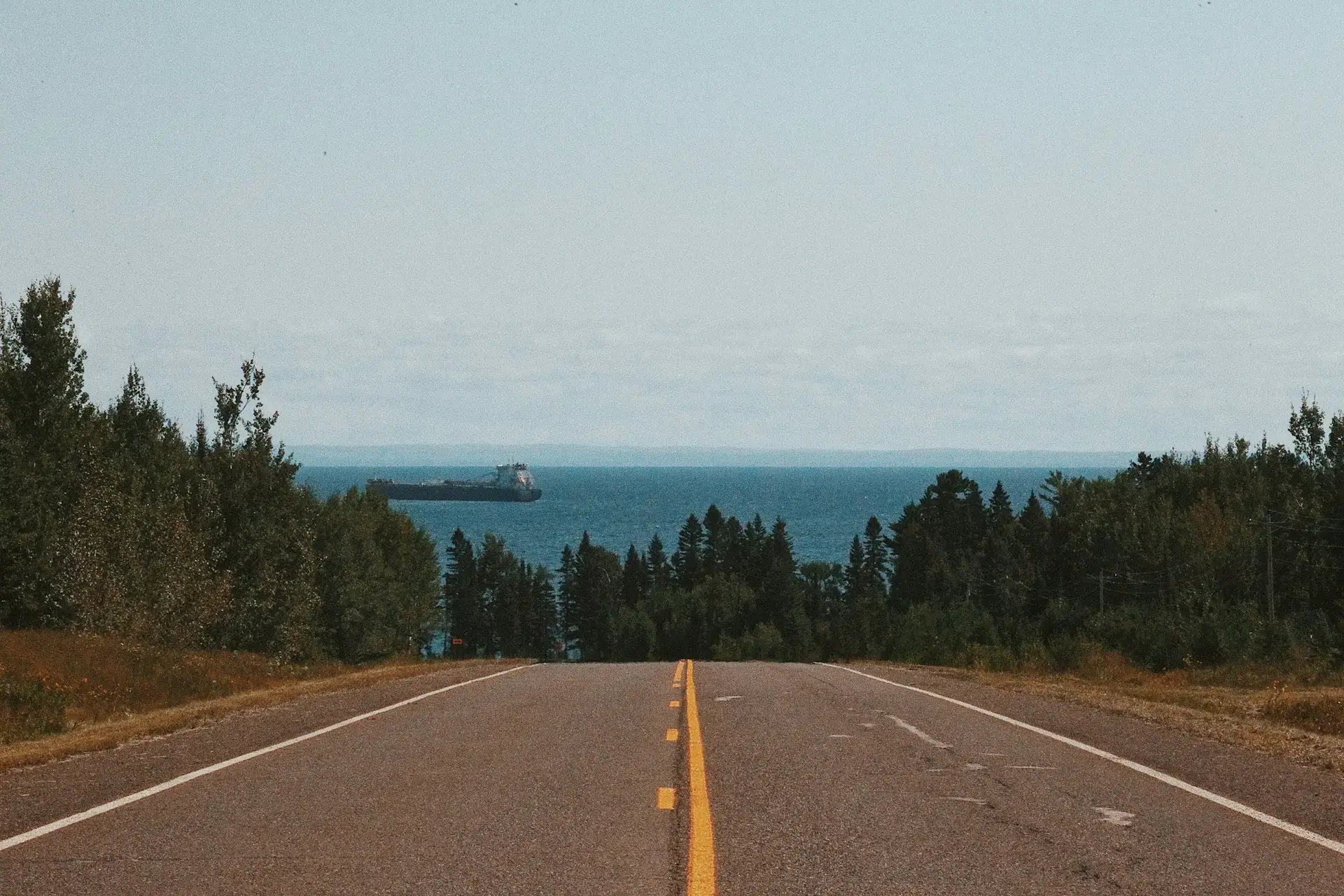 Road running between trees on the North Shore near Duluth, Minnesota