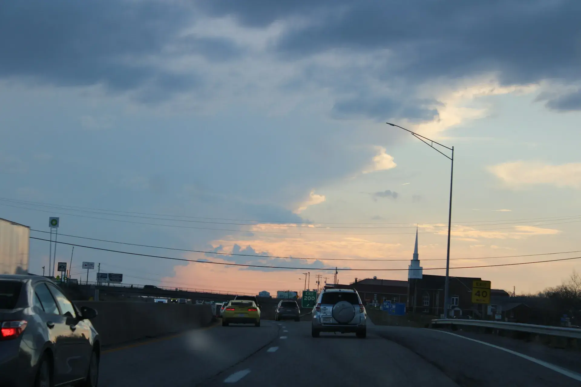 Cars driving on a highway at sunset in St. Louis, Missouri