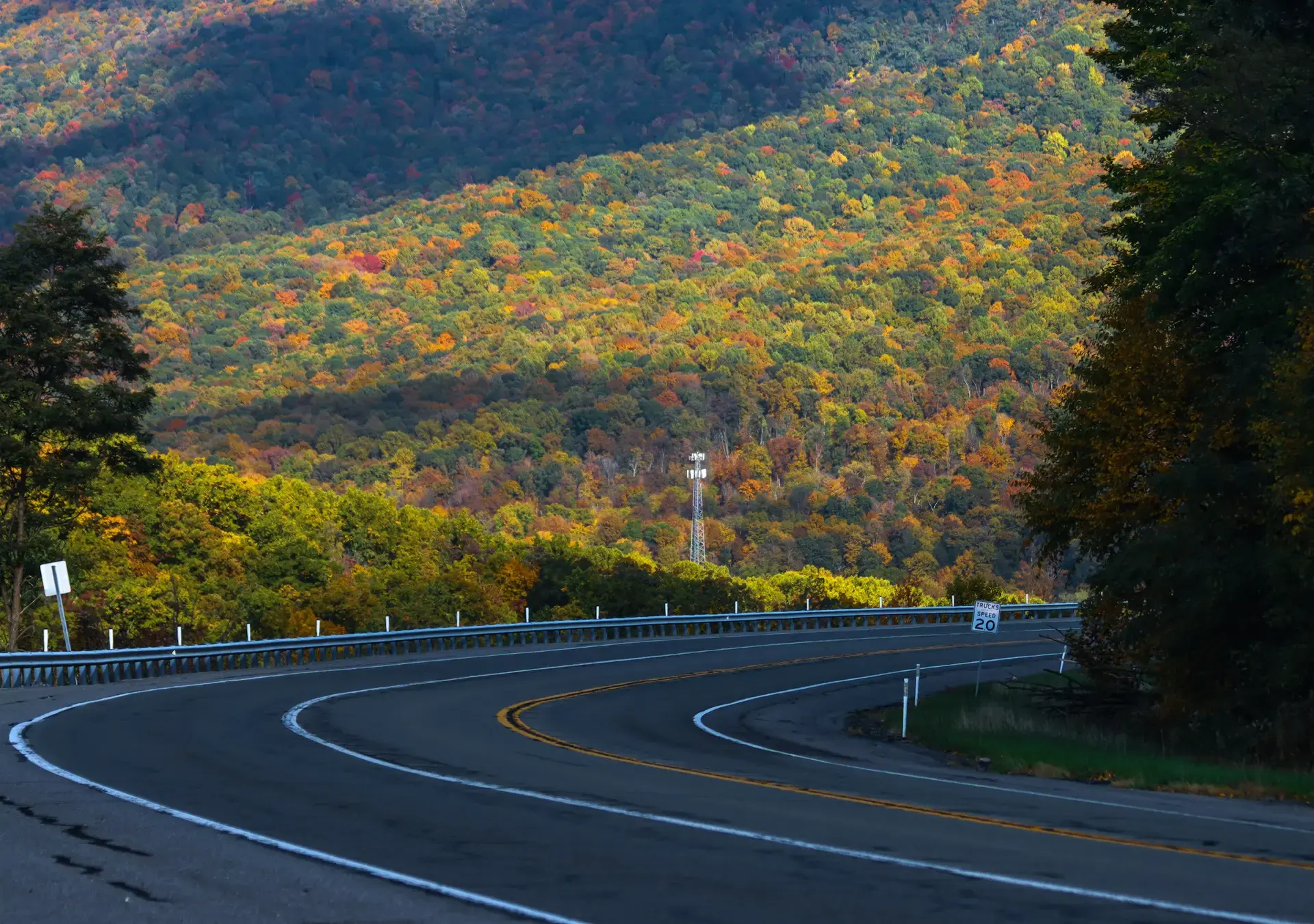 U.S. 30 curving through autumn hills toward a mountain in Pennsylvania